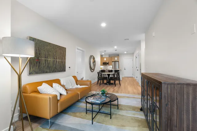 a living room with furniture and a rug