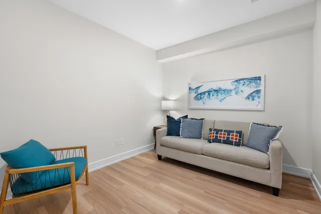 a white couch sitting next to a white wall