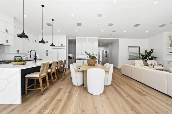 a open kitchen with stainless steel appliances kitchen island a large island in the center