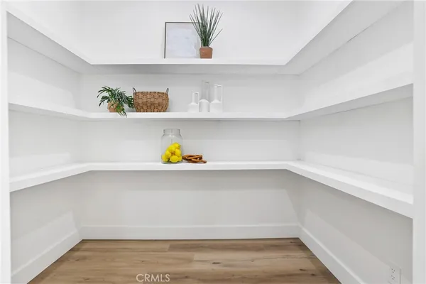 a bathroom with a bathtub a sink a mirror and shower