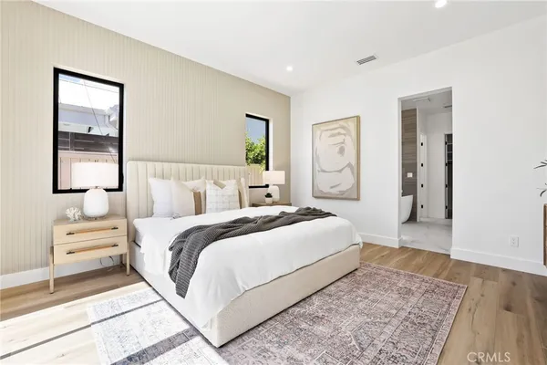 a view of walk in closet with white walls