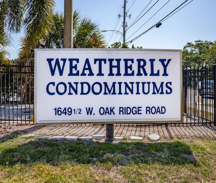 1625 West Oak Ridge Road, Unit C Orlando, FL 32809 - Photo 2 of 11 a sign broad on wooden wall