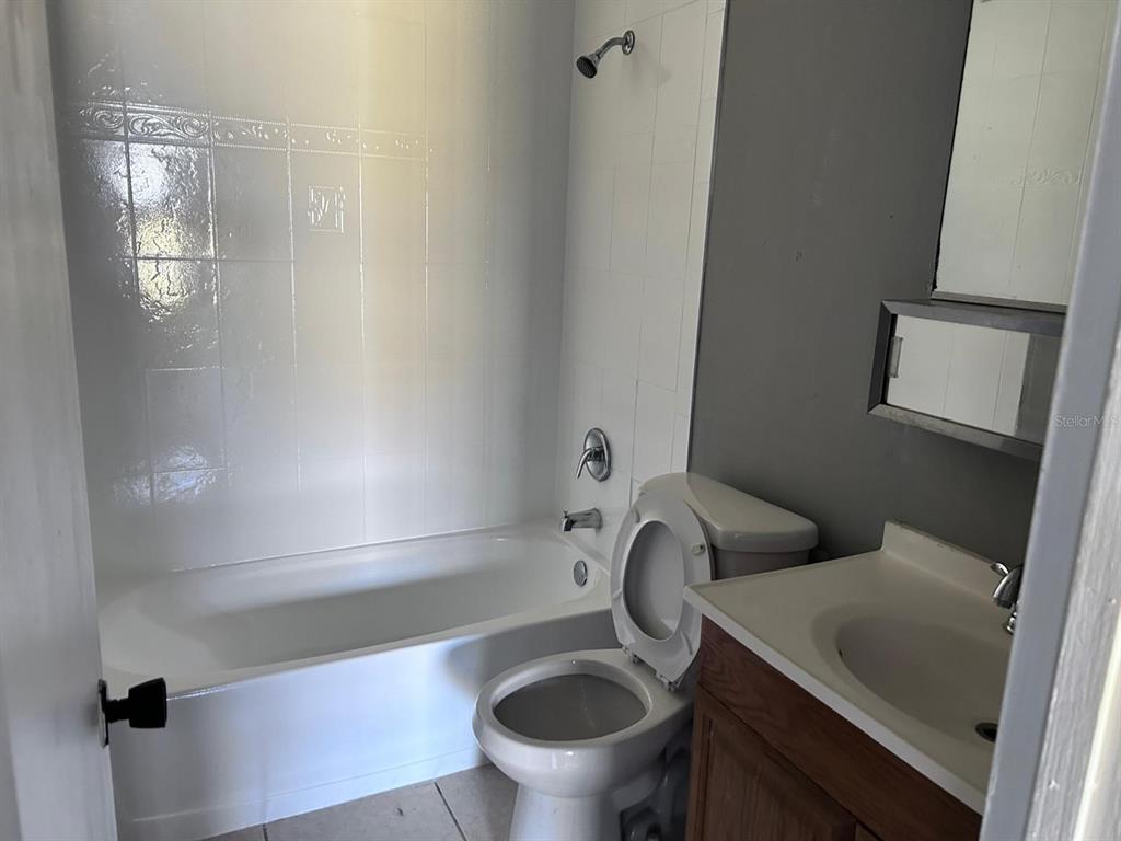 1625 West Oak Ridge Road, Unit C Orlando, FL 32809 - Photo 8 of 11 a bathroom with a toilet and a sink