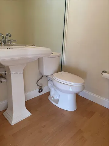 a bathroom with a toilet and a sink