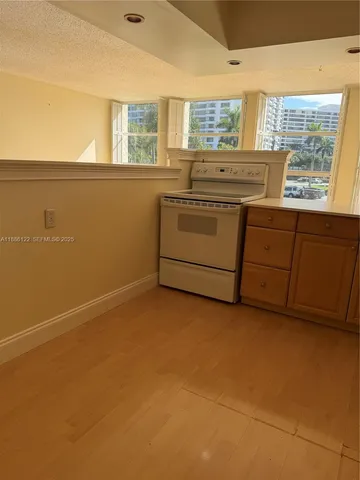 a kitchen with a cabinets and window