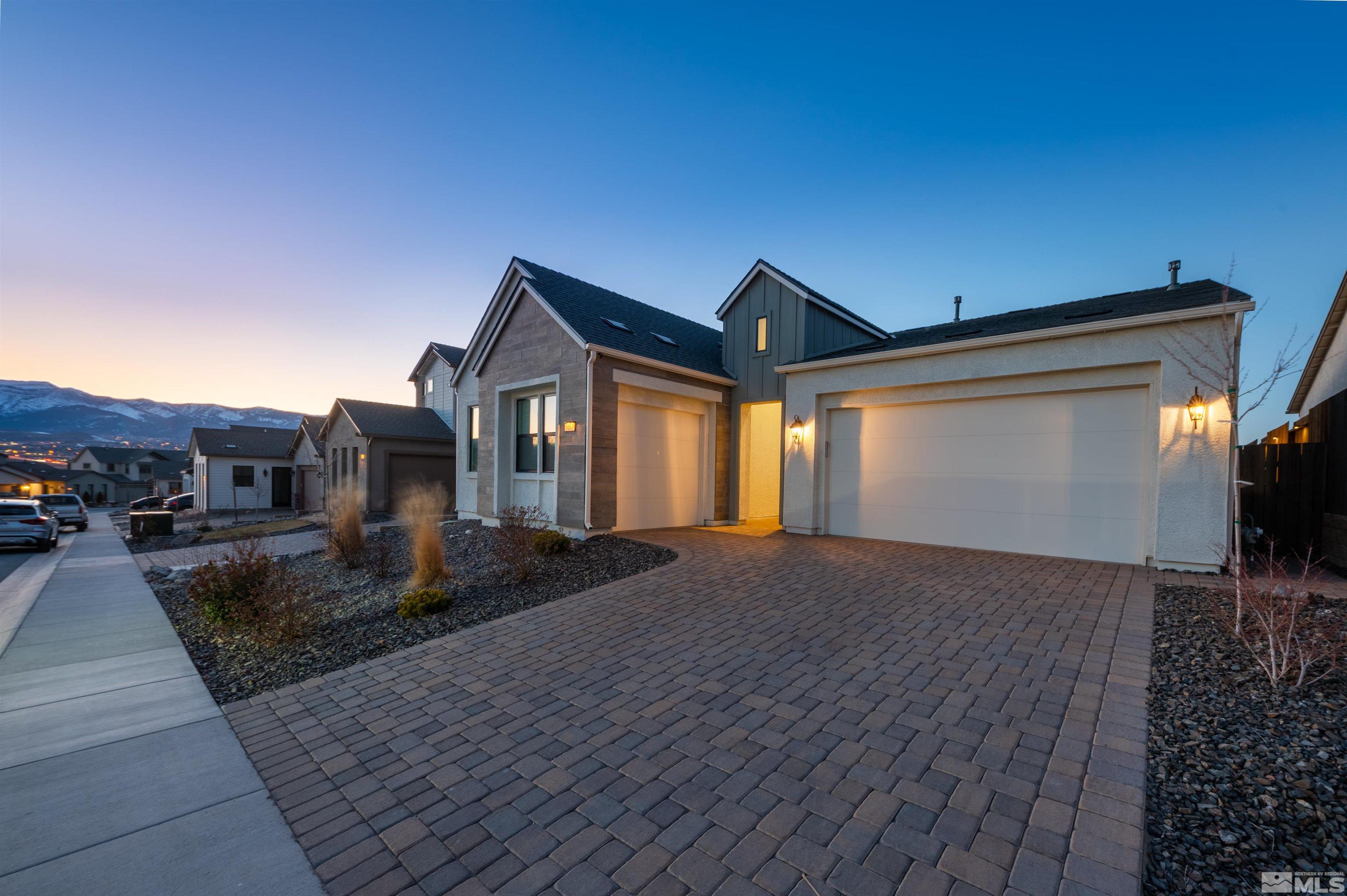3031 Country Wind Lane Reno, NV 89521 - Photo 3 of 34 a front view of a house with yard