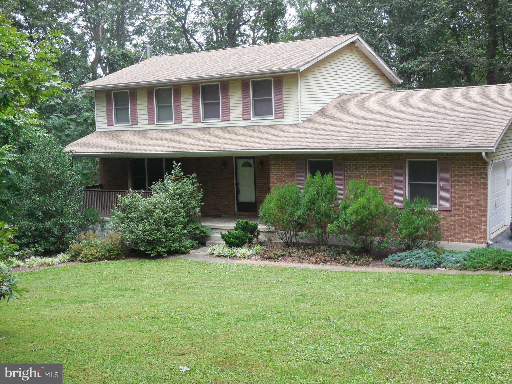 2667 Sandymount Road Finksburg, MD 21048 - Photo 1 of 30 a front view of a house with a yard