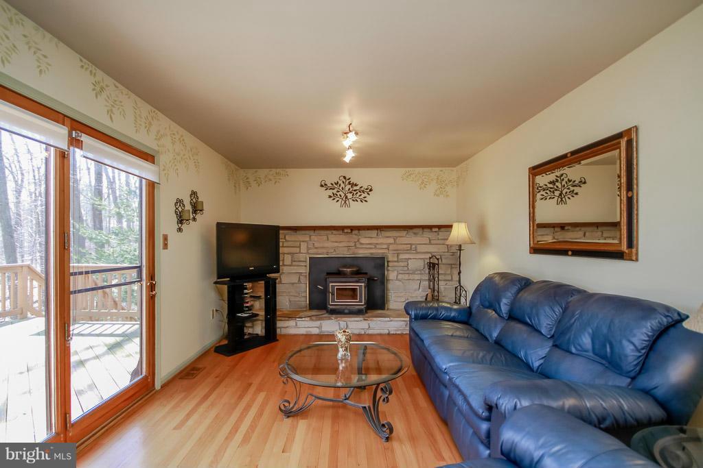 2667 Sandymount Road Finksburg, MD 21048 - Photo 19 of 30 a living room with furniture and a fireplace