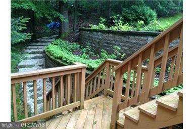 2667 Sandymount Road Finksburg, MD 21048 - Photo 3 of 30 a view of a wooden deck and a backyard