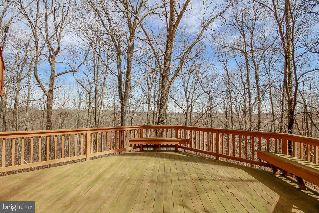 2667 Sandymount Road Finksburg, MD 21048 - Photo 6 of 30 a view of backyard with large trees and wooden fence