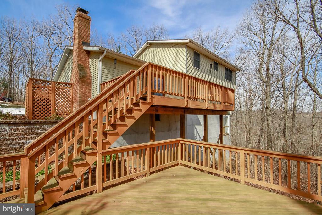 2667 Sandymount Road Finksburg, MD 21048 - Photo 8 of 30 a view of staircase with white walls and wooden floor