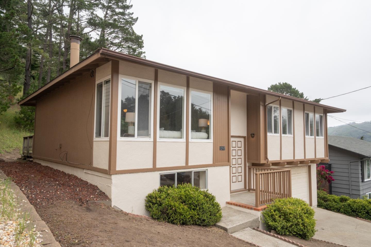 1287 Lerida Way Pacifica, CA 94044 - Photo 2 of 52 a view of a house with a yard