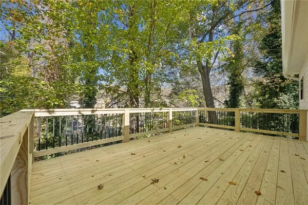a view of balcony with wooden floor
