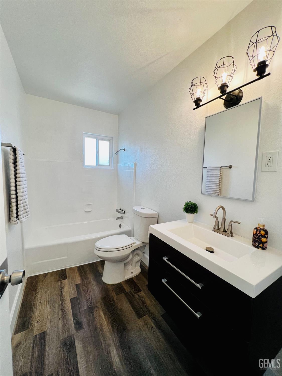 Undisclosed Address Bakersfield, CA 93304 - Photo 11 of 20 a bathroom with a sink and a toilet