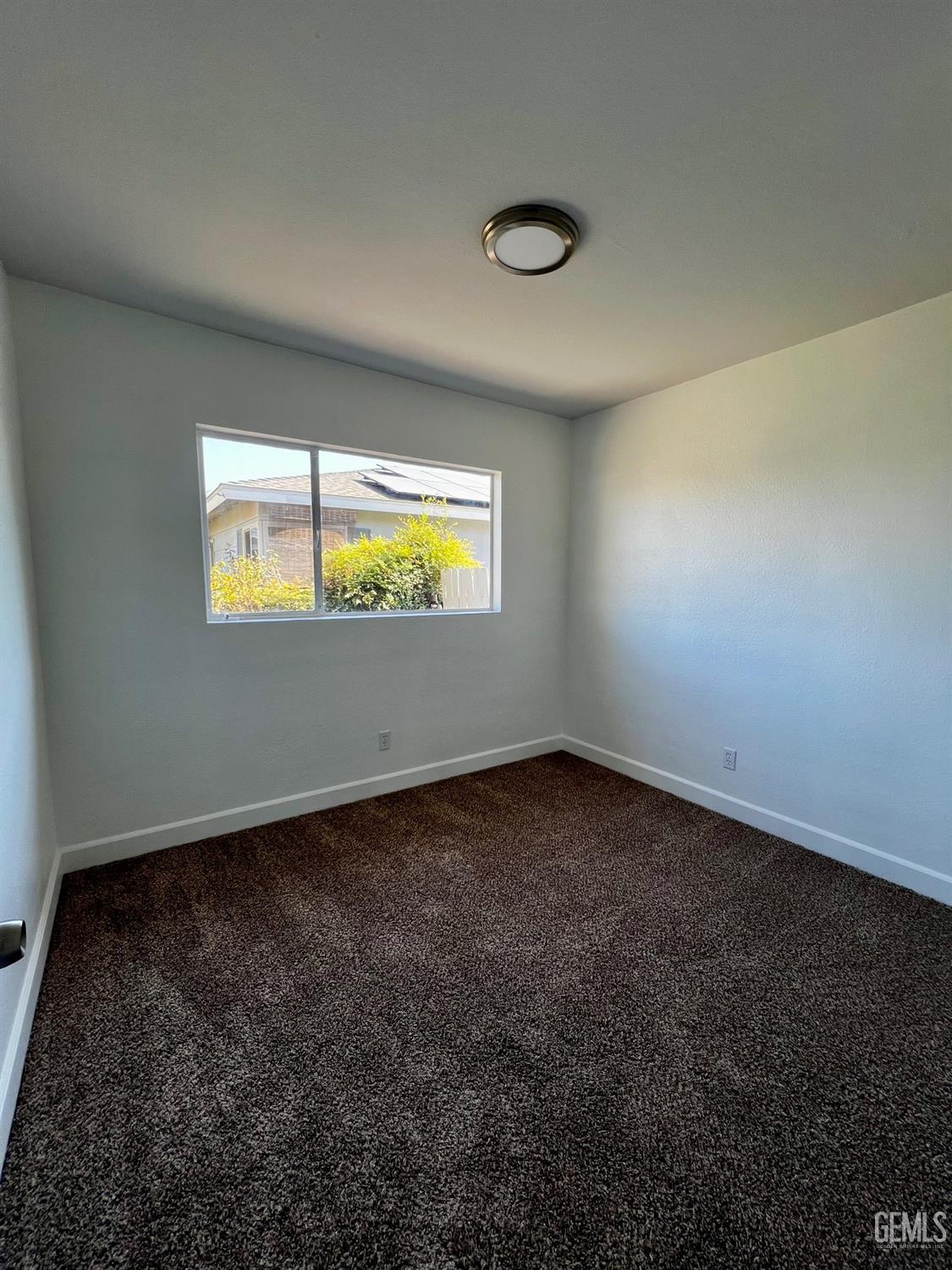 Undisclosed Address Bakersfield, CA 93304 - Photo 12 of 20 a view of an empty room and window