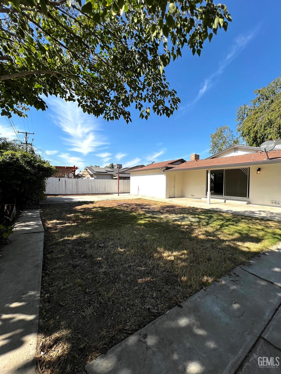 Undisclosed Address Bakersfield, CA 93304 - Photo 19 of 20 a front view of a house with a yard