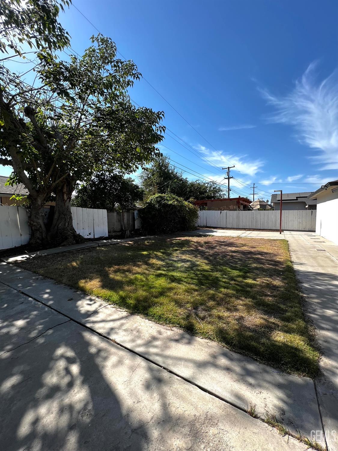 Undisclosed Address Bakersfield, CA 93304 - Photo 20 of 20 a view of a swimming pool with an outdoor space and seating area