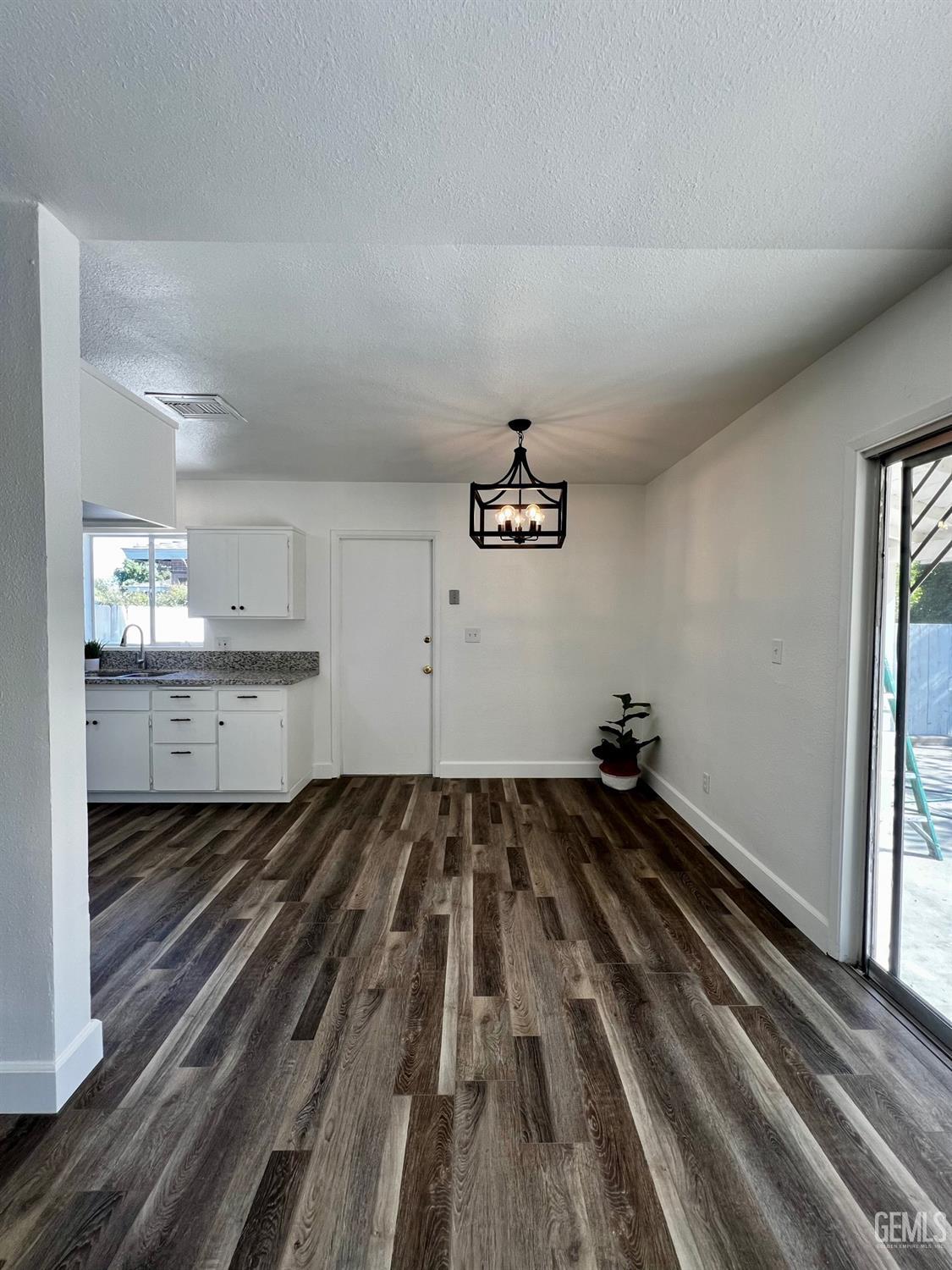 Undisclosed Address Bakersfield, CA 93304 - Photo 7 of 20 a view of a room with wooden floor