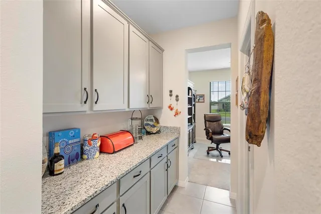 a kitchen with stainless steel appliances granite countertop a sink and cabinets