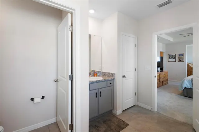 a view of a hallway with bathroom