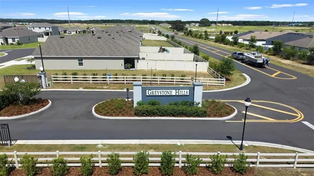a view of a swimming pool with a patio