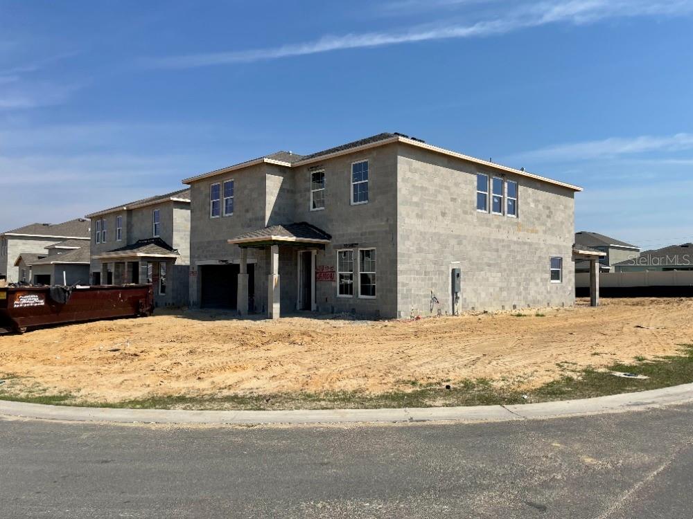 8953 Southwest 50th Terrace Ocala, FL 34476 - Photo 44 of 49 a front view of a house with a yard