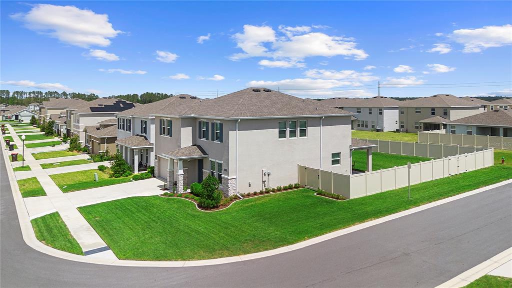 8953 Southwest 50th Terrace Ocala, FL 34476 - Photo 5 of 49 a view of a house with a big yard and large trees