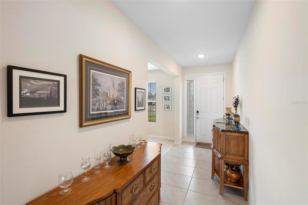 8953 Southwest 50th Terrace Ocala, FL 34476 - Photo 8 of 49 a hallway with furniture and window