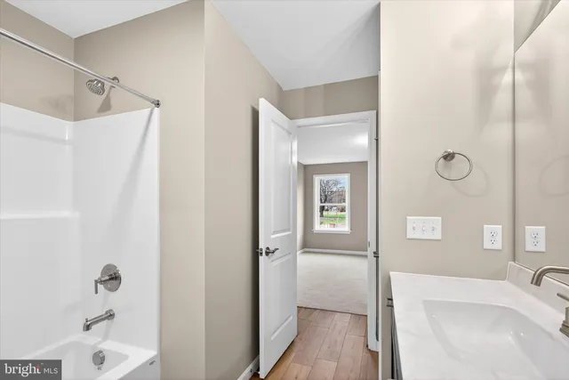 a view of a house with a yard and deck