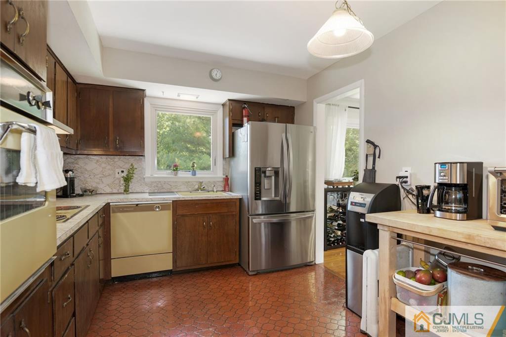 2 Poplar Road Hillsborough, NJ 08844 - Photo 15 of 22 a kitchen with a refrigerator stove and sink