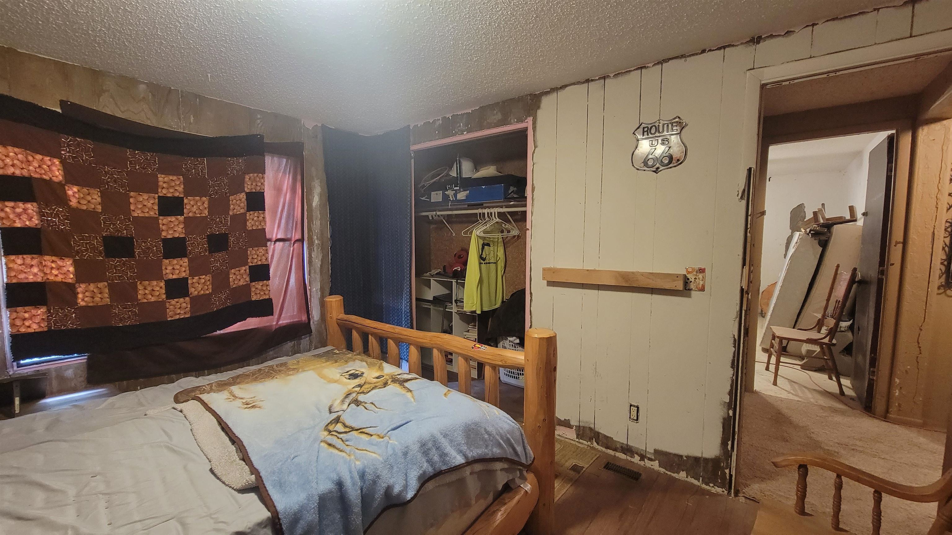 1844 M Road Fruita, CO 81521 - Photo 28 of 32 a bed sitting in a bedroom next to a window