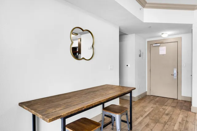 a view of a kitchen area with wooden floor