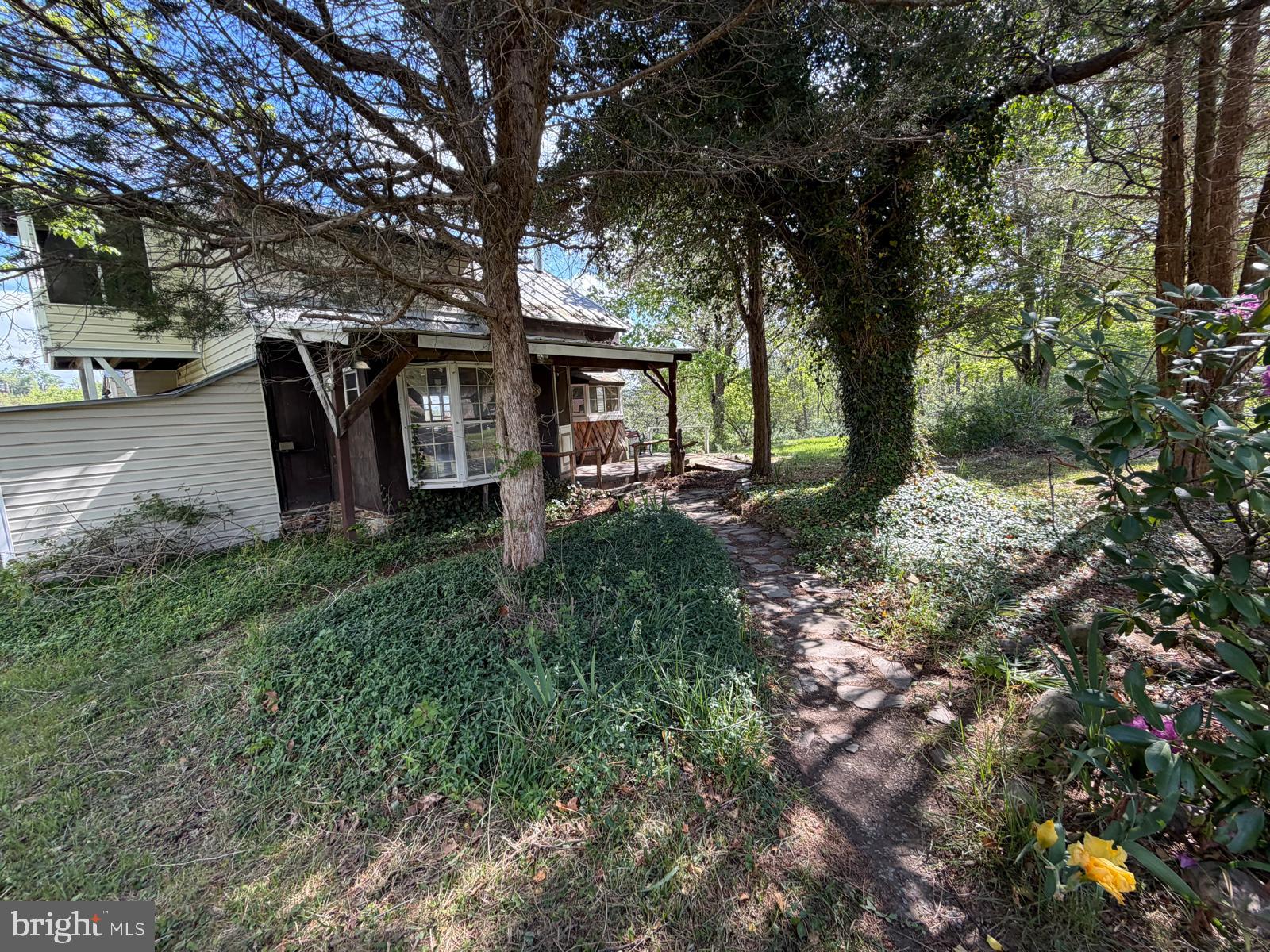 986 Rushing River Road Augusta, WV 26704 - Photo 49 of 56 Charming garden path to a cozy home.