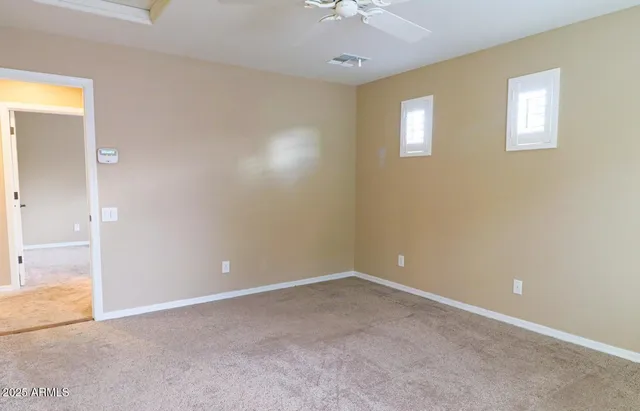 an empty room with windows