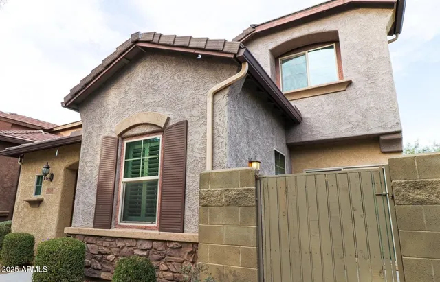 a view of a house with a door and a window