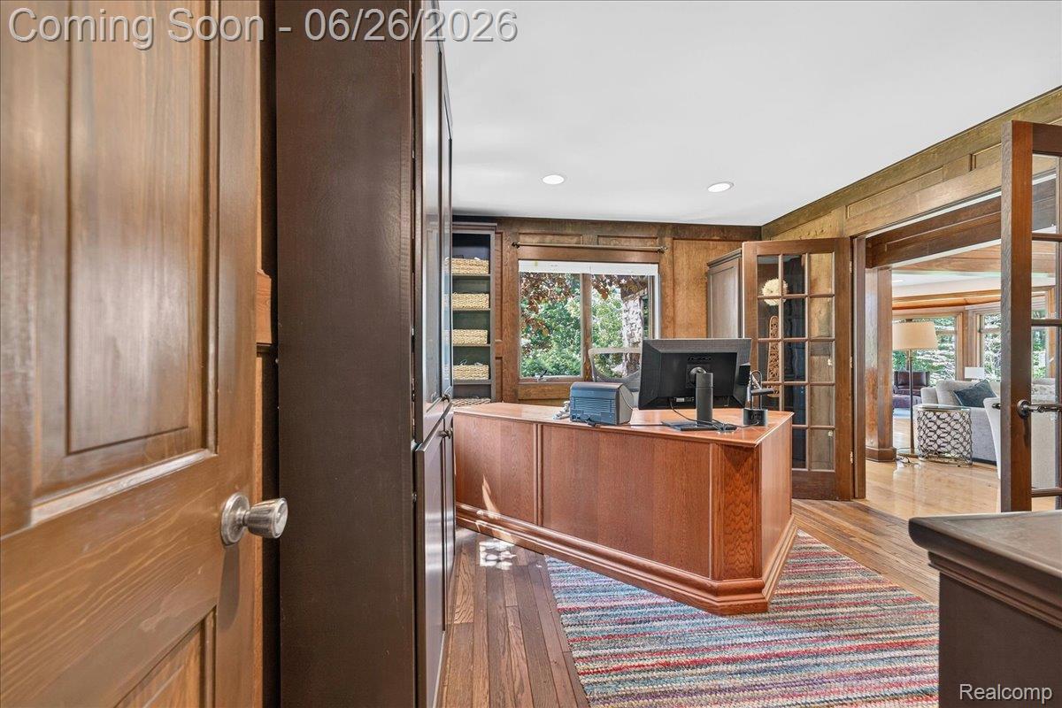 29498 East River Road Grosse Ile, MI 48138 - Photo 27 of 66 Office with Wood Paneled Walls and Custom Built Shelves and Entry to Living Room