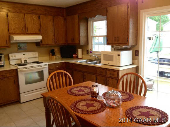 53 Ox Road Waynesboro, VA 22980 - Photo 7 of 14 a kitchen with a table chairs sink and cabinets