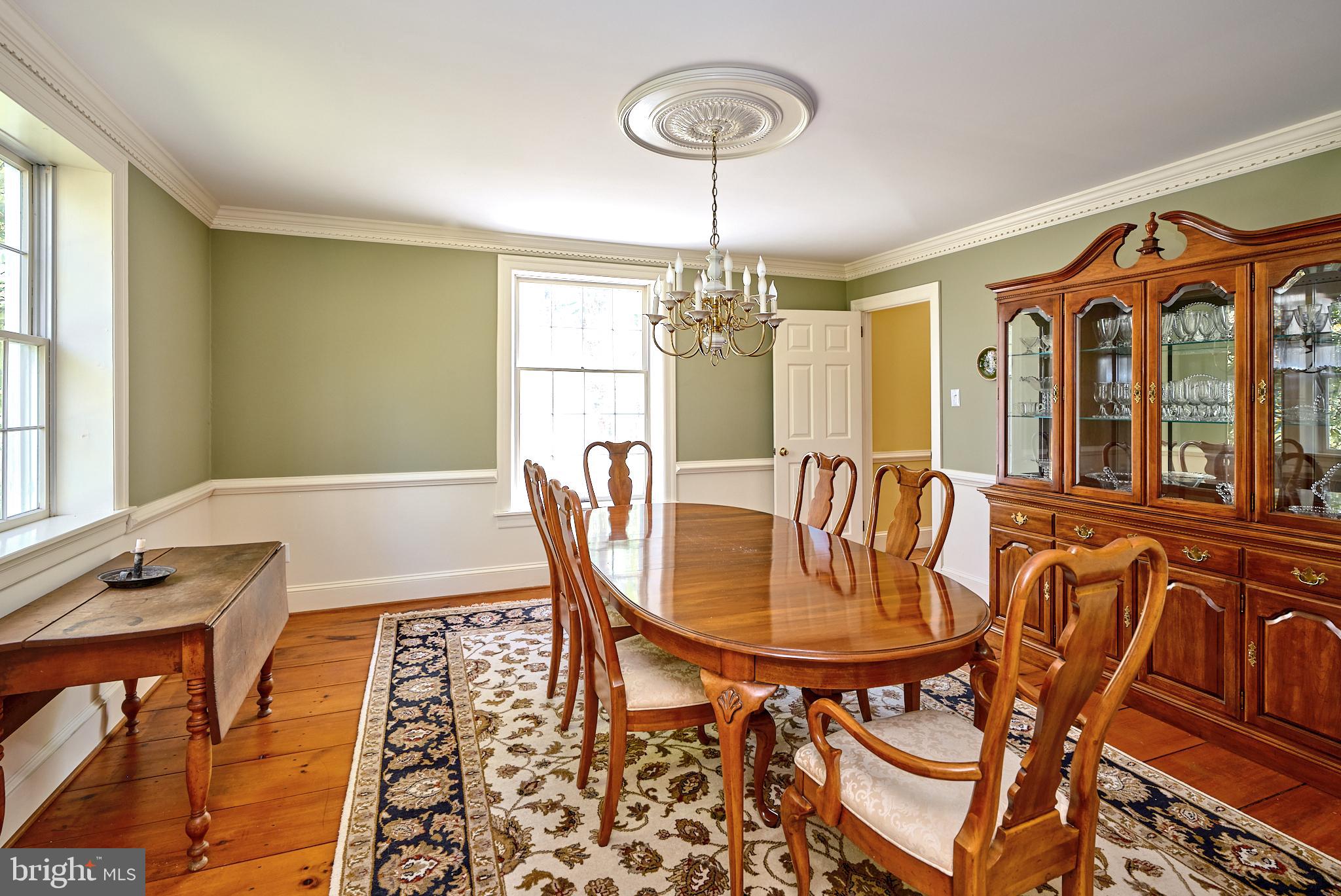 2981 Comfort Road New Hope, PA 18938 - Photo 12 of 33 a dining room with furniture a chandelier and wooden floor