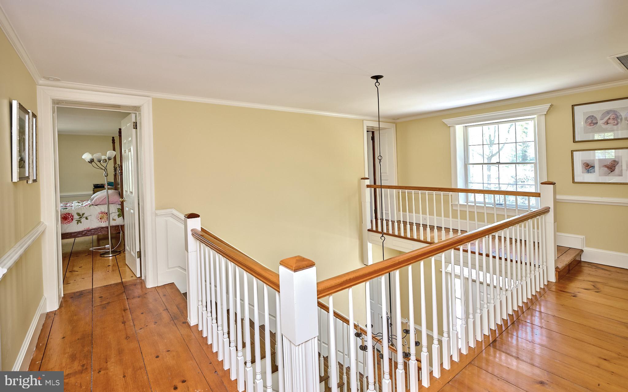 2981 Comfort Road New Hope, PA 18938 - Photo 16 of 33 a view of a hallway with wooden floor and staircase