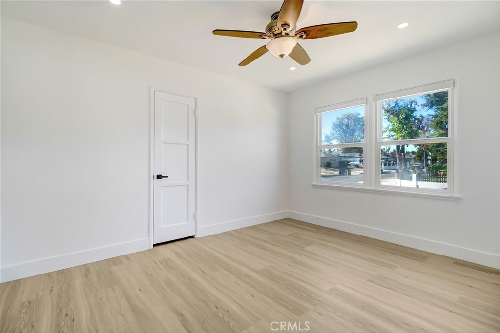 6632 Belmar Avenue Reseda, CA 91335 - Photo 4 of 10 wooden floor in an empty room with a window