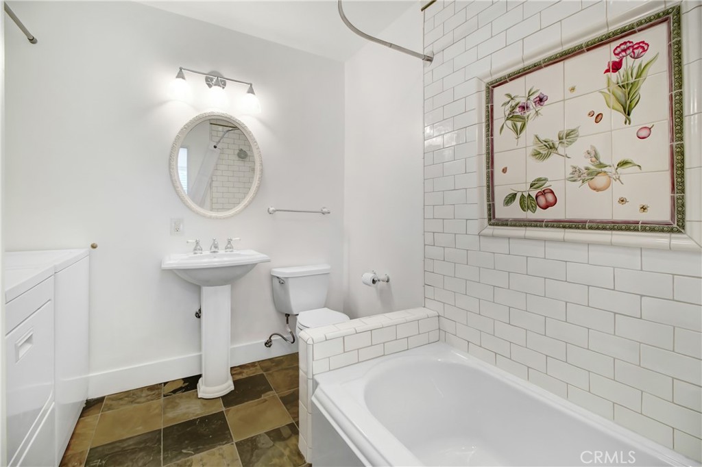 6632 Belmar Avenue Reseda, CA 91335 - Photo 8 of 10 a bathroom with a sink a bathtub and a toilet