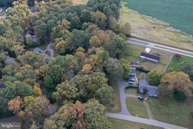 an aerial view of a house with yard swimming pool and outdoor seating