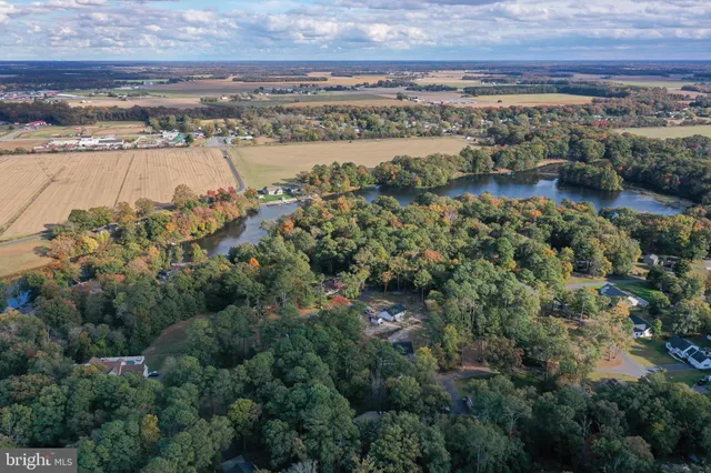 an aerial view of house with yard