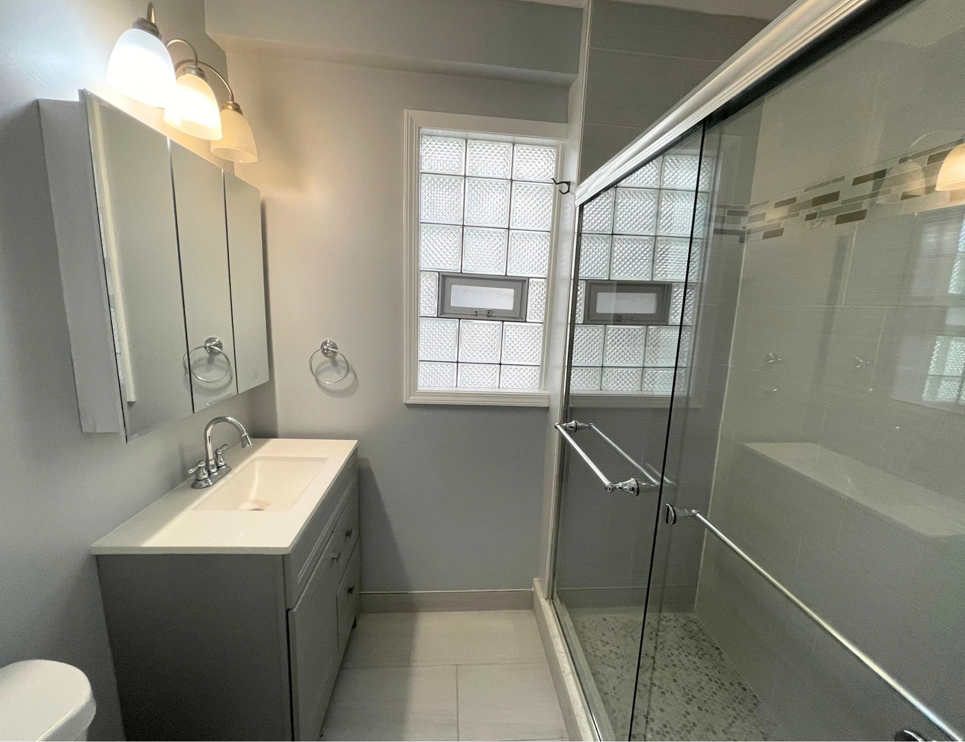 1836 South May Street, Unit 1 Chicago, IL 60608 - Photo 14 of 15 a bathroom with a sink toilet and shower