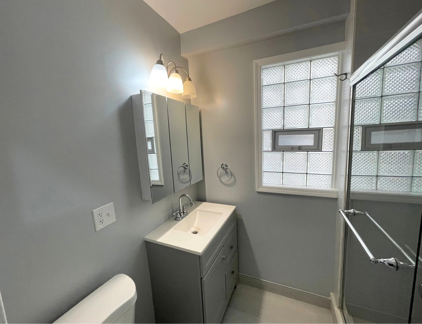 1836 South May Street, Unit 1 Chicago, IL 60608 - Photo 15 of 15 a bathroom with a sink toilet and shower