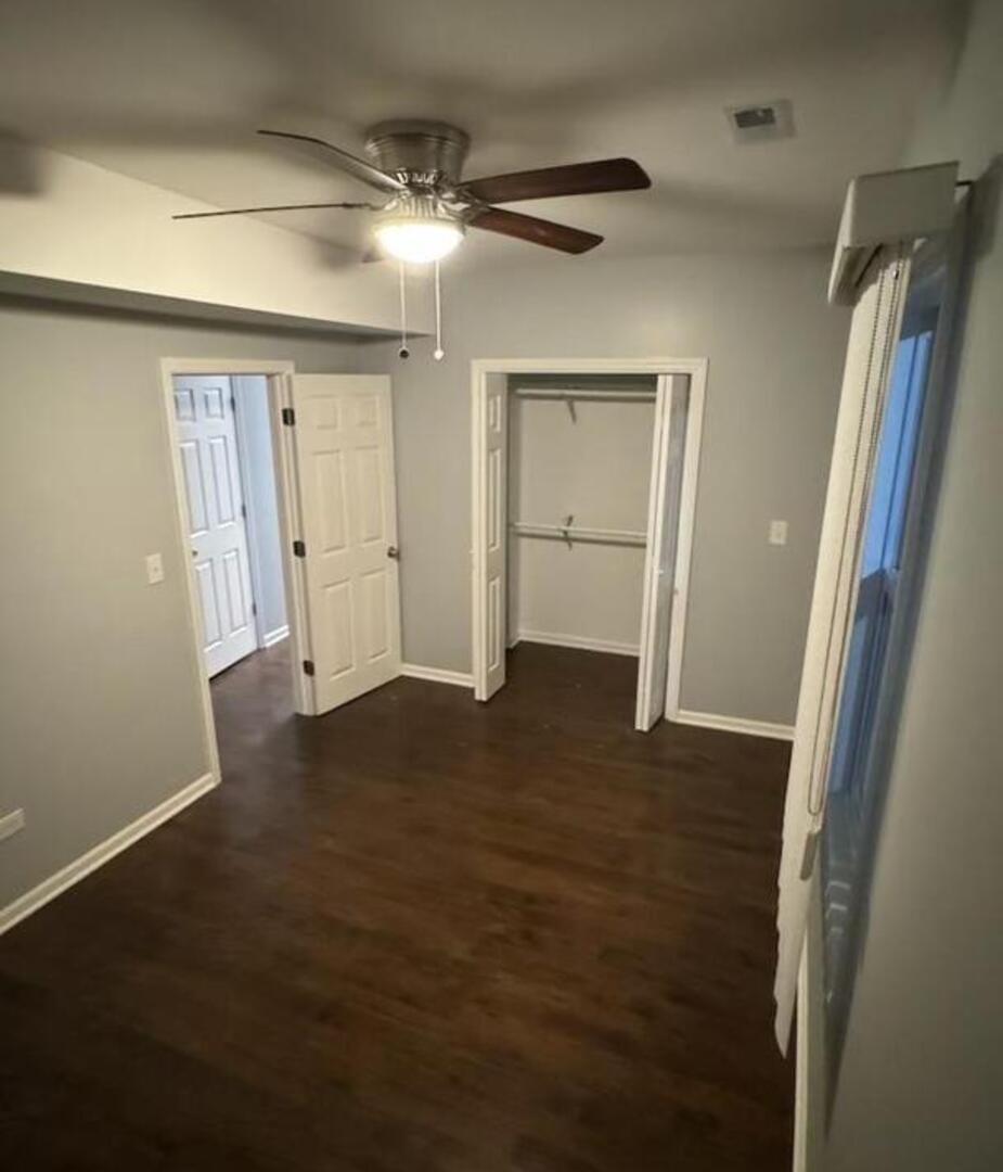 1836 South May Street, Unit 1 Chicago, IL 60608 - Photo 8 of 15 en empty room with wooden floor and fan