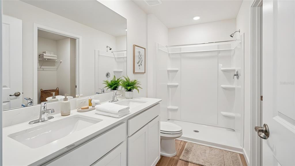 4023 Kona Circle Spring Hill, FL 34608 - Photo 6 of 18 a bathroom with a sink a toilet and shower
