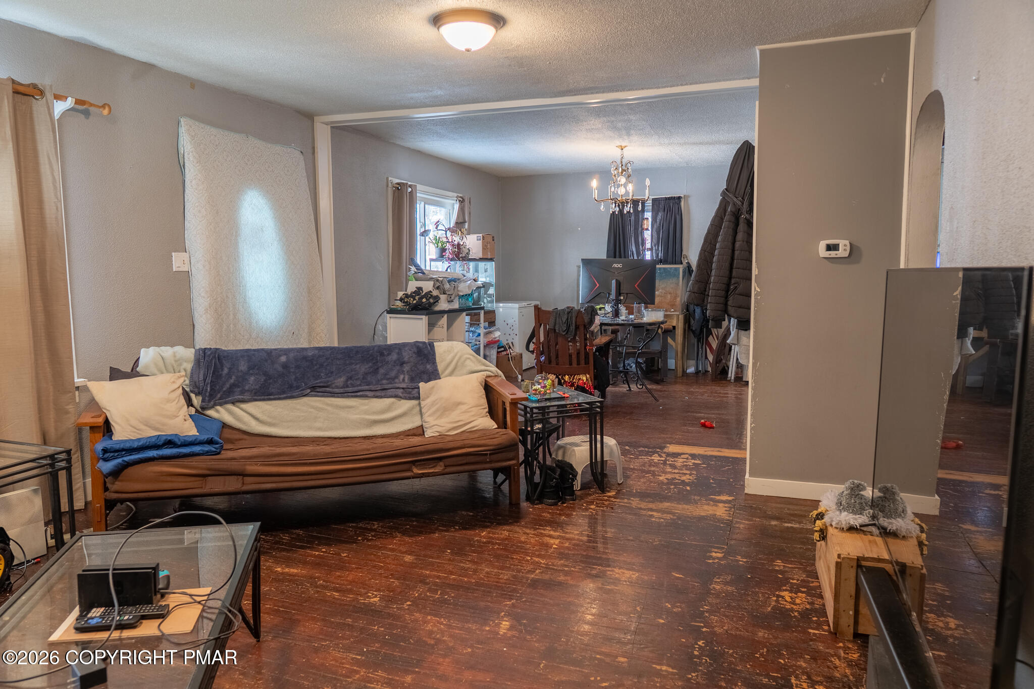 106 Independence Road East Stroudsburg, PA 18301 - Photo 16 of 30 a living room with furniture a flat screen tv and a table