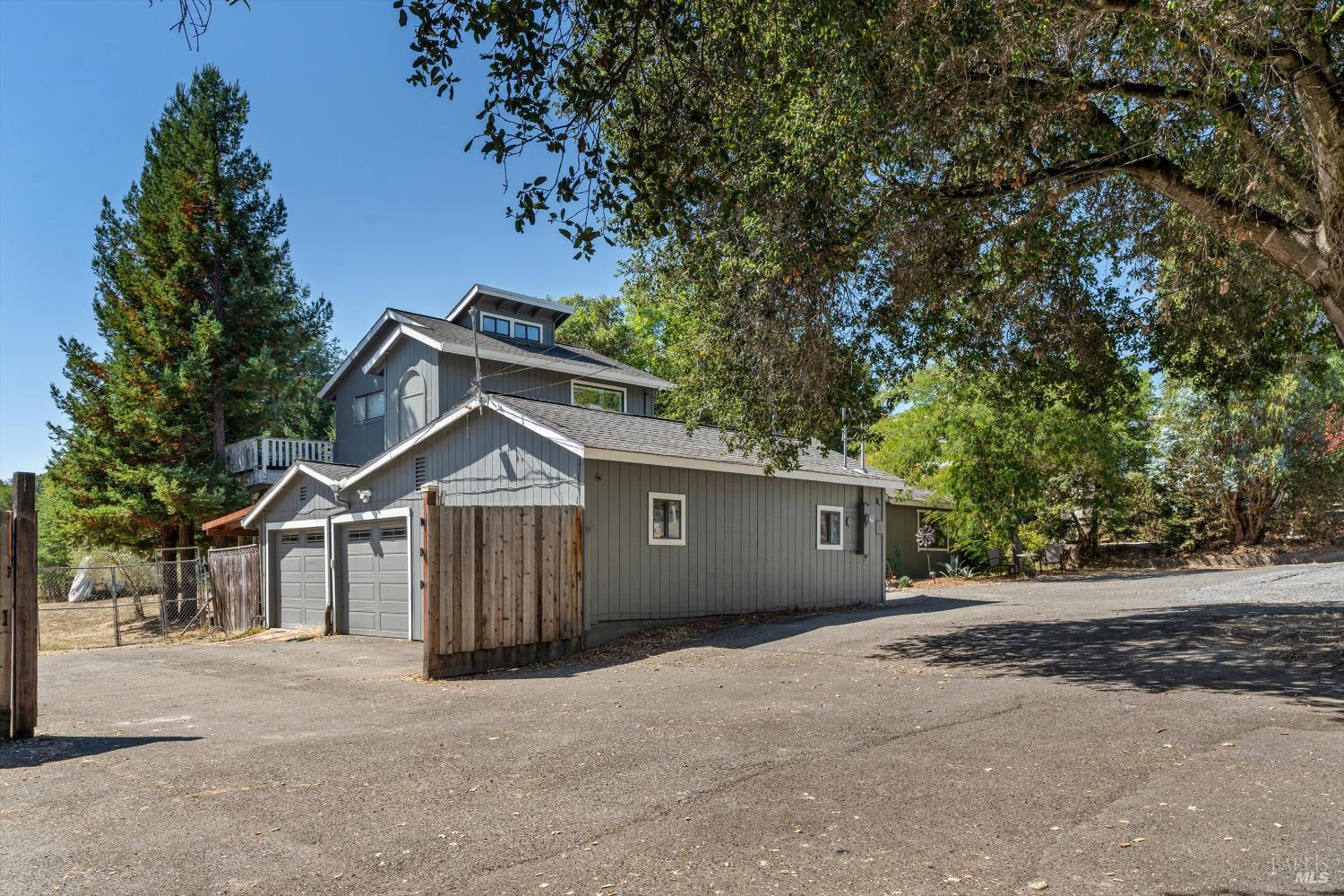 8061 Elphick Road Sebastopol, CA 95472 - Photo 27 of 40 a front view of a house with a garden and tree