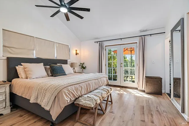 a bedroom with a large bed and a window